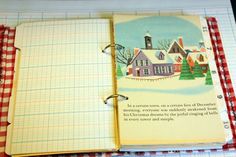 an open notebook with a christmas scene on the cover and a red checkered background