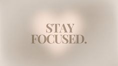 the words stay focused are displayed on a white background with soft light and shadow effects