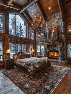 a large bedroom with a fireplace and chandelier