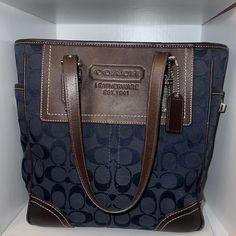 This Is An Original Coach Purse Which Measures 9 Inches Wide And 10 Inches Tall. No Box Or Sleeve Included. Good Condition Blue Shoulder Bag With Leather Trim For Daily Use, Blue Bags With Leather Trim And Double Handle, Blue Leather Trim Shopping Bag, Blue Bags With Leather Trim For Shopping, Blue Leather Trim Bags For Shopping, Everyday Blue Shoulder Bag With Leather Trim, Blue Shoulder Bag With Leather Trim For Everyday, Blue Rectangular Shoulder Bag With Leather Trim, Classic Blue Coated Canvas Shoulder Bag