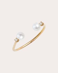 Set atop an open-ended band, this 14-karat gold ring is capped with genuine freshwater pearls and round-cut diamond accents for iridescent shine. 14k yellow gold, freshwater pearl and diamond Diamond carat: 0.06 ctw Diamond color: F Diamond clarity: VS Polish with soft cloth Handmade in Canada Measurements Band width: 1.3mm Sustainability Metrics: Circular Economy: product is intentionally designed with 50% of actively cycled materials Conflict-Free: 100% of products are recycled or conflict-fre Open Pearl Ring, Baby Pearls, Pearl And Diamond Ring, Circular Economy, Open Ended, Diamond Carat, Women Diamond, Diamond Color, Open Ring