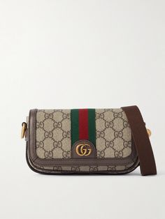 It's hard to deny the timeless appeal of Gucci's 'Ophidia' series, and this mini shoulder bag is a fine example. Crafted in Italy from signature coated-canvas, it's mapped with the house's unmistakable 'GG' monogram, first unveiled in the '30s, and finished with smart leather trims. The compact size fits your phone, wallet and keys. Crossbody Bag Outfit, Shop Gucci, Gucci Ophidia, Flat Dress Shoes, Gucci Eyewear, Raffia Bag, Print Coat, Mini Shoulder Bag, Canvas Shoulder Bag