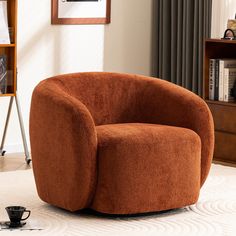 a brown chair sitting on top of a white rug