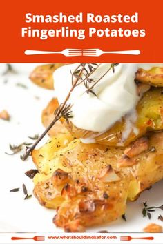 roasted fingerling potatoes with whipped cream on top and rosemary sprigs in the foreground