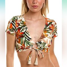 Cropped Short Sleeve Bikini Top With Removeable Soft Cups.Loop Tie At Front With Tassle Trim| Fabric: Microfiber Jersey 85% Nylon/15% Spandex| Care: Hand Wash Cold/Hang To Dry| Sun Protection: No| Closure: Pull With Loop Tie At Front| Chlorine Resistant: No| Adjustable: No| Cup Support: Removeable Soft Cups| Front Coverage: Moderate Coverage| Bottom Coverage: Moderate Coverage| Country Of Origin: Imported Description Go Swimming In Something Stylish! Get A New Vince Camuto Swimsuit For All Yur S Beachwear V-neck Tops With Tropical Print, Orange V-neck Swimwear For Vacation, Printed Beachwear Tops For Pool, Floral Print Beachwear Tops For Pool, Floral Beachwear Tops, Triangle Top With Floral Print For Beachwear, Tropical Beach Tops For Pool Season, Tropical Fitted Top For Beach Party, Fitted Tropical Top For Beach Party