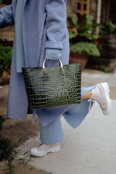 Elevate your style with the Gina Tote Bag, a must-have tote bag crafted from high-quality Italian leather. The unique two-tone colorway features contrasting shades of vibrant and deep green that exude sophistication and bold elegance. The croc-embossed texture adds an exotic touch, while the structured design and reinforced base maintain its sleek silhouette no matter what you carry. Whether pairing it with your favorite power suit or a little black dress, the SISTER EPIC Gina Tote Bag is design Luxury Green Shoulder Bag For Errands, Green Luxury Bag For Errands, Luxury Green Bags For Errands, Luxury Green Tote Bucket Bag, Luxury Green Tote Bag, Luxury Green Satchel For Daily Use, Luxury Green Satchel For Errands, Luxury Green Rectangular Bucket Bag, Luxury Green Top Handle Bucket Bag