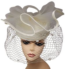 Lady Diane Brand Veiled Fascinator Style: 20231014 Color shown: White Chic Fitted Fascinator For Party, Spring Formal Fitted Costume Hats And Headpieces, Chic Fitted Headpieces For Party, Chic Fitted Party Headpiece, Elegant Spring Party Headpieces, Chic Evening Hats For Spring, Chic Spring Evening Hats, Elegant Fitted Costume Hats And Headpieces For Spring, Fitted Formal Headpieces For Spring