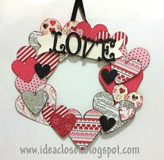 a heart shaped wreath with the word love on it