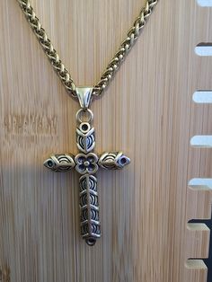 Ships Fast, From Florida, USA. Easy Returns If Not Satisfied.(But you will Love It) The Chain length is 24", Made from Stainless Steel. Pendant is 2" x 1 1/2" Nice Sturdy Necklace.  Choose Gold or Silver. Embrace the spirit of Ragnar Lothbrok with our Ragnar Necklace,  inspired by Viking and Norse mythology. Featuring a handcrafted  Ragnar cross and Athelstan cross design, this piece blends Viking,  pagan, and medieval Christian influences.  Perfect for fans of Viking jewelry and those  seeking a unique, historical touch.  Shop all our Jewelry Here. https://designsbyrobthomas.etsy.com Spiritual Metal Cross Necklaces, Spiritual Metal Pendant Cross Necklace, Spiritual Cross Jewelry In Metal, Spiritual Metal Cross Pendant Necklace, Spiritual Metal Cross Necklace, Adjustable Cross Chain Jewelry, Nickel-free Gold Cross Necklace, Metal Cross Necklace With Box Chain, Spiritual Cross Pendant Necklace For Jewelry Making