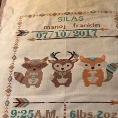 a cross stitch pattern with three animals on it and the words, sla 6 mandi franklin ot10 - bolt