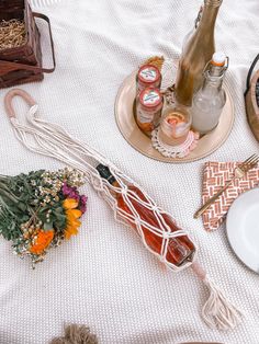 an assortment of items on a white table cloth