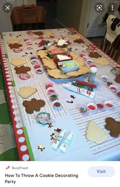 the table is covered with cookies and candy