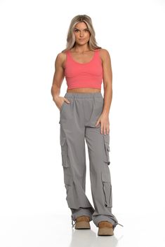 NEW Limited Edition & custom designed Dusty Grey Parachute Pants! Not only did we spend months designing these amazing cargo style pants, but we PERFECTED them in the process! These pants are insanely versatile due to their lightweight material and trendy style. They feature adjustable ankle cuffs that you can leave wide or tie up for a jogger look. The elastic waist-band allows for a comfortable fit and the multiple pockets provide great functionality. These pants easily can be worn for any wor Trendy High-waisted Cargo Pants With Pockets, Stretch Wide-leg Parachute Pants With Cargo Pockets, High Waist Stretch Parachute Pants In Cargo Style, Fitted Wide Leg Cargo Pants With Cargo Pockets, Trendy Parachute Pants With Multiple Pockets And Loose Fit, Stretch High Waist Parachute Pants With Cargo Pockets, Fitted Wide-leg Parachute Pants With Cargo Pockets, Fitted High-waisted Cargo Pants With Multiple Pockets, Fitted High-waisted Utility Parachute Pants