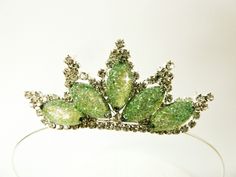 a tiara with green leaves on it