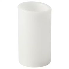 a white vase sitting on top of a table