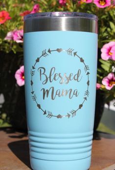 a light blue tumbler with the words, blessed mama on it