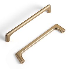 two brass handles on white background