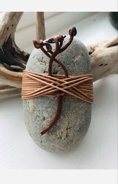 a rock that has some kind of wire wrapped around it