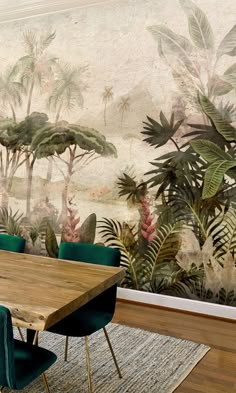 a dining room table with green chairs in front of a tropical wallpapered background