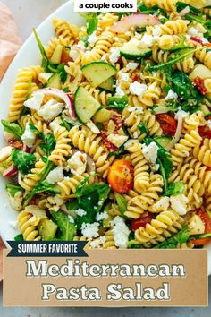 a white plate topped with pasta salad