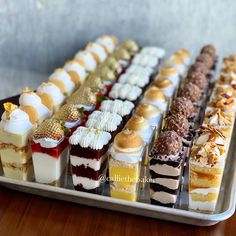 there are many different desserts on the tray