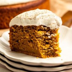 a slice of carrot cake with white frosting