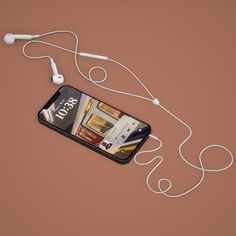 a cell phone with ear buds attached to it