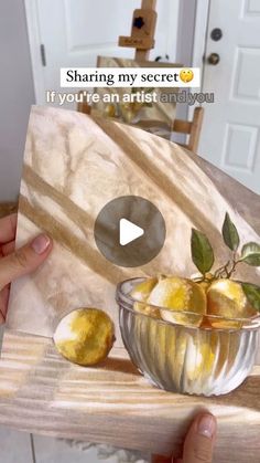 someone is holding up a card with lemons in a glass bowl