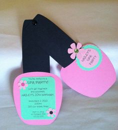 a pair of pink and black baby bibs