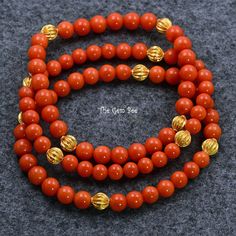 Thank you for coming in! Mediterranean Sardinia Coral sphere bead, no dye, 100% natural tomato red color. The beads are premium quality, you do not find hairline cracks which are common with Mediterranean coral beads. Classic stretchy bracelet with 18k solid yellow gold fluted spacers!  You'll get one of the bracelets you see! Bracelet 1:  6.2mm corals, 7inch length Bracelet 2: 5.88m-6.2mm corals, 7inch length Bracelet 3: 5.25mm-5.7mm corals, 6.8inch length   MATERIAL: 18k Solid gold, Natural co Elegant Orange Beaded Bracelets With Gemstones, Luxury Red Beaded Bracelets As Gift, Elegant Red Coral Beaded Bracelets With Round Beads, Red Coral Beaded Bracelets With Polished Beads, Luxury Red Beaded Bracelets For Gift, Luxury Red Beaded Bracelet For Gift, Red Coral Beaded Bracelet With Polished Beads, Elegant Red Beaded Bracelets For Meditation, Red Coral Beaded Bracelets With Round Beads