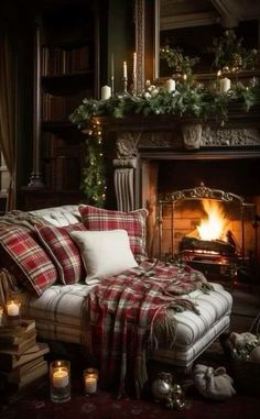 a living room filled with furniture and a fire place covered in blankets next to a fireplace