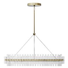 a large chandelier with clear glass rods hanging from it's brass frame