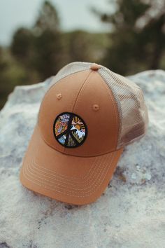 Discover Atomicchild's Circle of Peace Classic Trucker Hat - a timeless 6-panel accessory with a snapback closure for a perfect fit and a classic woven patch. Versatile, comfortable, and adorned with a symbol of peace and unity. Get yours now! Outdoor Adjustable Baseball Cap With Embroidered Patch, Adjustable Snapback Hat With Embroidered Patch, Retro Adjustable Hat With Embroidered Patch, Adjustable Snapback Hat With Embroidered Patch For Outdoor, Brown Snapback Baseball Cap For Spring, Adjustable Trucker Hat With Embroidered Patch And Curved Bill, Adjustable Trucker Hat With Embroidered Patch, Adjustable Hat With Embroidered Patch And Curved Bill, Adjustable Brown Hat With Embroidered Patch