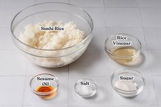 ingredients to make sushi rice sit in bowls on a white tile flooring area