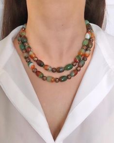 Agate and Lava Stone Multistrand Beaded Necklace ✅ NECKLACE FEATURES * Handmade Item: Each necklace is meticulously crafted by hand, ensuring quality and uniqueness. * Materials: patterned green and brown natural agate stone, brown shiny lava stone, gold plated details and chain * Length: 43 cm (17 inches) + 5 cm (2 inches) adjustment chain.    -If you require a longer extension chain, please let me know. * Color Discrepancies: Please be aware that color variations may occur due to different mon Romantic Anniversary, Trendy Fashion Accessories, Agate Beads, Beautiful Gift Boxes, Green Brown, Multi Strand, Green And Brown, Stone Necklace, Luxury Jewelry