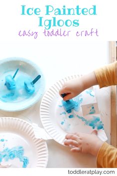 a child's hands painting on paper plates with blue paint and the words, ice painted igloos easy toddler craft