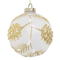 a white and gold christmas ornament hanging from a chain