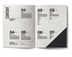 an open magazine with black and white numbers on the front cover, inside pages spread out