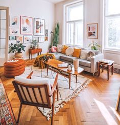 a living room filled with furniture and lots of windows