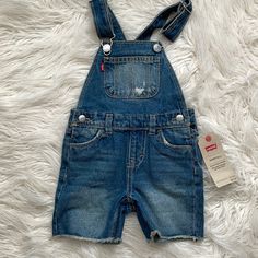 New Never Worn Kids Coverall Cute Blue Overalls For Playwear, Casual Blue Overalls For Playwear, Blue Overalls For Playtime In Spring, Cute Blue Bib Front Overalls, Blue Shortalls For Spring Playtime, Levi's Blue Summer Overalls, Casual Blue Levi's Overalls, Levi's Blue Overalls For Spring, Levi's Blue Overalls