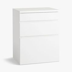 a white filing cabinet with three drawers