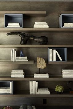 an image of a book shelf with books and other items on it in the room