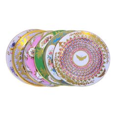 six plates with different designs on them, all in different colors and patterns are stacked together