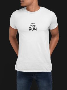 a man wearing a white t - shirt with the words run on it