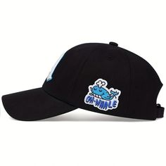 a black hat with an embroidered blue whale on the front and white lettering that says oh hume