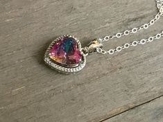 Tiny Mystic Topaz heart Necklace. Mystic Alexandrite Quartz pendant. Rainbow Quartz charm. Delcate jewelry. Sterling Silver necklace. Valentine day gift. Sterling Silver jewelry. Beautiful Mystic Topaz Sterling Silver Necklace. Vintage style statement. The pendant with jump ring measures 16 mm long and 11 mm wide. Also, I have the same pendants in slightly bigger size, 20 x 13 mm. Sterling silver chain is 16 inches long on a mannequin. This gorgeous necklace comes in a complimentary, beautiful j Iridescent Fine Jewelry As A Gift, Rainbow Sterling Silver Jewelry Gift, Rainbow Sterling Silver Jewelry As Gift, Rainbow Colored Sterling Silver Jewelry Gift, Nickel Free Rainbow Jewelry For Gift, Nickel-free Rainbow Jewelry Gift, Nickel-free Rainbow Jewelry For Gifts, Rainbow Nickel-free Jewelry For Gifts, Rainbow Cubic Zirconia Jewelry As Gift