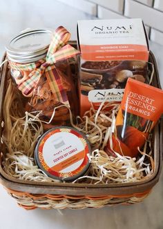 a basket filled with different types of food and snacks on top of a countertop