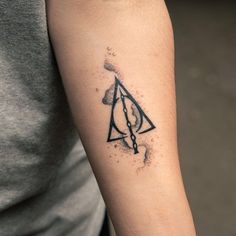 a harry potter tattoo on the arm