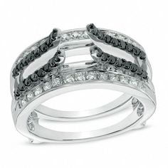 a white gold ring with black and white diamonds