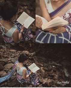 a woman sitting on rocks reading a book and looking down at her hands while holding an open book